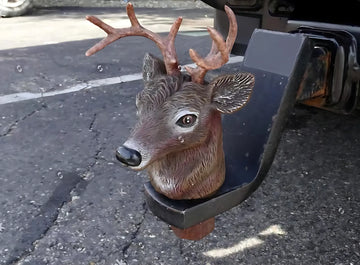 Deer style trailer hitch cover