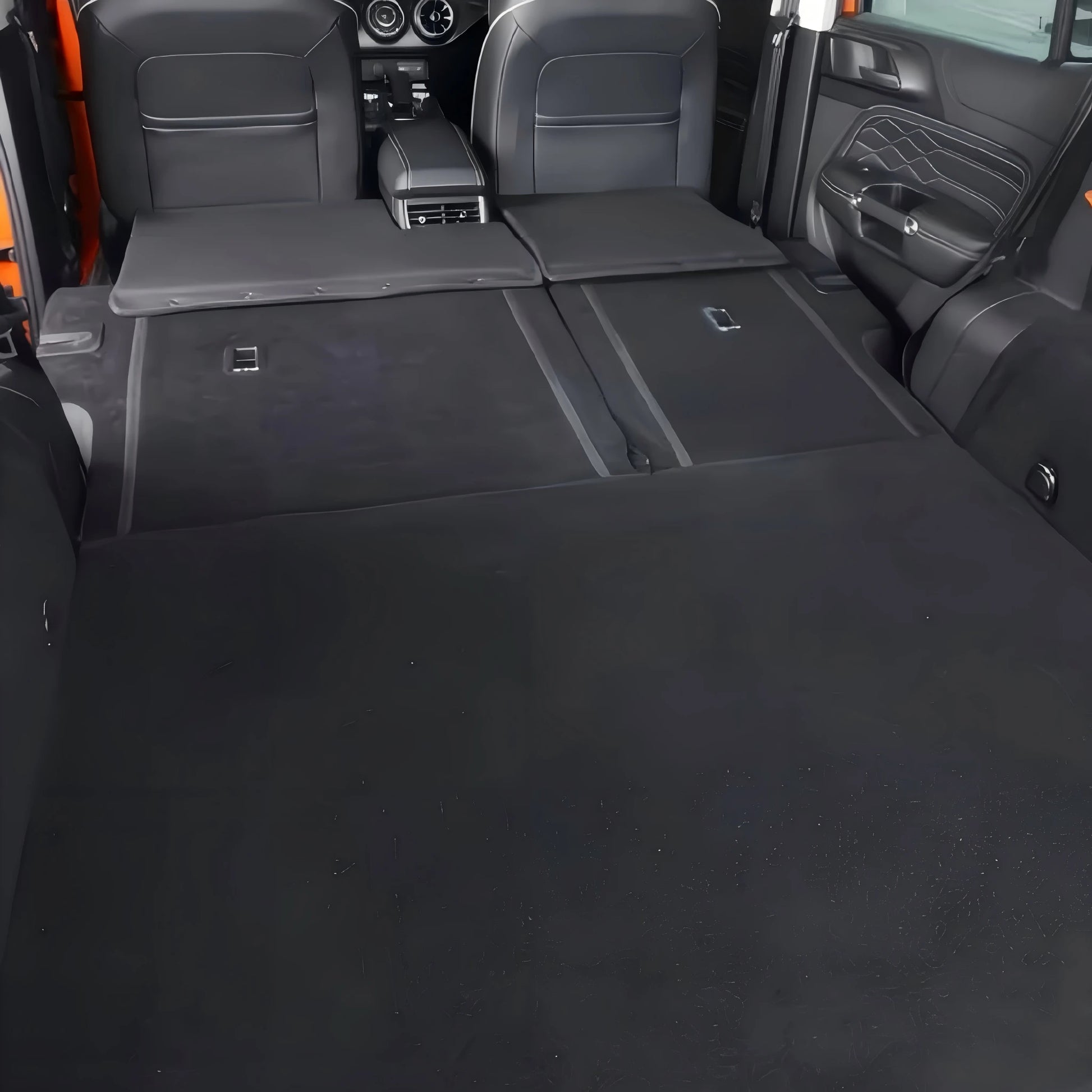 Tank 300 interior showing a fully flat cargo area and rear seat bed extension setup.
